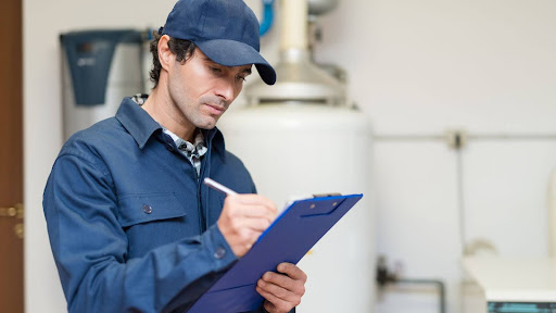 Plumber performing plumbing maintenance